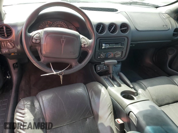 1999 Pontiac Firebird Trans Am with VIN 2G2FV32GXX2229175, listed as a Copart auction lot 65678225 with 180,298 mi miles and Salvage title. Bid and sale history available at DreamBid. Image 8.
