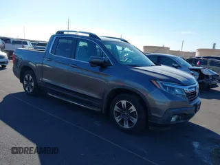 2017 Honda Ridgeline RTL-T z VIN 5FPYK2F64HB001113, wystawiony jako IAAI lot #41524753 z przebiegiem 108 801 mil mil oraz . Historia ofert i sprzedaży dostępna na DreamBid. Obrazek 1.