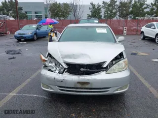 2004 Toyota Camry LE with VIN 4T1BF32K84U589638, listed as a IAAI auction lot 41571339 with 90,311 mi miles. Bid and sale history available at carsss.com. Image 12.