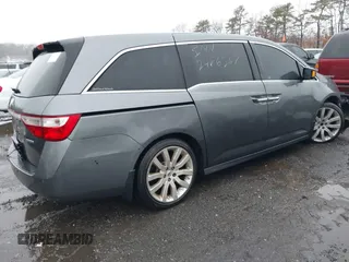 2012 Honda Odyssey Touring with VIN 5FNRL5H98CB089871, listed as a IAAI auction lot 41351447 with 999,999 mi miles. Bid and sale history available at carsss.com. Image 4.