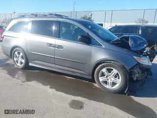 2011 Honda Odyssey Touring with VIN 5FNRL5H96BB068452, listed as a IAAI auction lot 41862153 with 76,602 mi miles. Bid and sale history available at carsss.com. Image 1.
