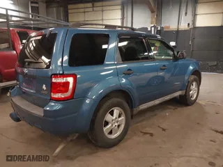 2009 Ford Escape XLT with VIN 1FMCU93G99KB70918, listed as a IAAI auction lot 41942399 with 141,158 mi miles. Bid and sale history available at carsss.com. Image 4.