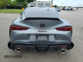 2022 Toyota Supra 3.0 with VIN WZ1DB0C09NW047931, listed as a Copart auction lot 59527955 with 61,941 mi miles and Salvage title. Bid and sale history available at DreamBid. Image 6.