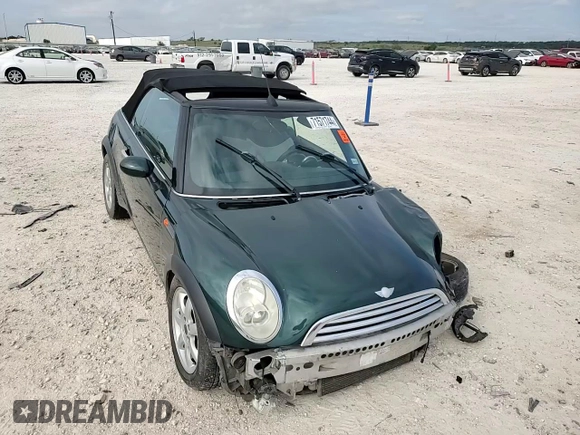 2007 MINI Convertible with VIN WMWRF33567TF66784, listed as a Copart auction lot 71571744 with 115,008 mi miles and Salvage Title. Bid and sale history available at DreamBid. Image 11.