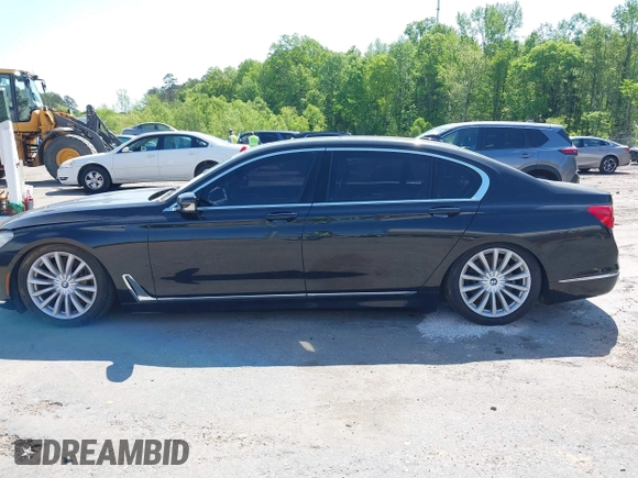 2016 BMW 7 Series 740i with VIN WBA7E2C55GG547752, listed as a IAAI auction lot 41992704 with Not Provided miles and . Bid and sale history available at carsss.com. Image 13.