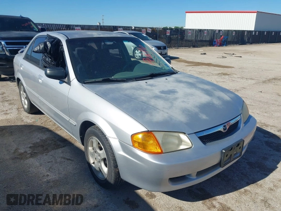 2000 Mazda Protege ES with VIN JM1BJ2213Y0284890, listed as a IAAI auction lot 42088671 with 215,104 mi miles and . Bid and sale history available at DreamBid. Image 1.
