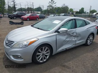 2014 Hyundai Azera Limited z VIN KMHFH4JG0EA396451, wystawiony jako IAAI lot #42493447 z przebiegiem 166 810 mil mil oraz . Historia ofert i sprzedaży dostępna na DreamBid. Obrazek 2.