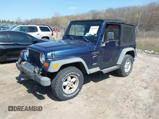 2000 Jeep Wrangler Sport with VIN 1J4FA49S7YP736479, listed as a IAAI auction lot 42042493 with 271,220 mi miles. Bid and sale history available at carsss.com. Image 2.