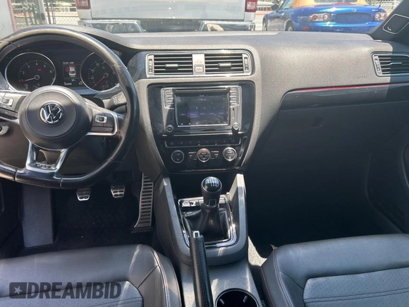 2017 Volkswagen Jetta GLI z VIN 3VW5T7AJ9HM330125, wystawiony jako Copart lot #57632155 z przebiegiem 103 949 mil mil oraz Czysty tytuł • Clean title. Historia ofert i sprzedaży dostępna na DreamBid. Obrazek 9.