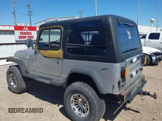 1994 Jeep Wrangler S with VIN 1J4FY19P9RP438376, listed as a IAAI auction lot 41751057 with 165,407 mi miles. Bid and sale history available at carsss.com. Image 3.