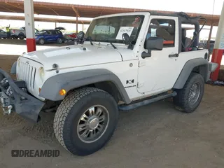 2007 Jeep Wrangler X with VIN 1J4FA24137L128418, listed as a IAAI auction lot 42317921 with 148,412 mi miles and . Bid and sale history available at DreamBid. Image 17.