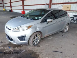 2013 Ford Fiesta SE with VIN 3FADP4EJ2DM173842, listed as a IAAI auction lot 42048262 with 82,637 mi miles. Bid and sale history available at carsss.com. Image 2.