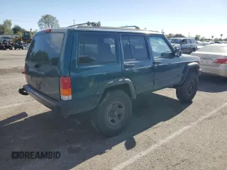 1997 Jeep Cherokee Sport with VIN 1J4FT68S4VL545385, listed as a Copart auction lot 49616325 with 239,798 mi miles and Salvage Title. Bid and sale history available at carsss.com. Image 3.