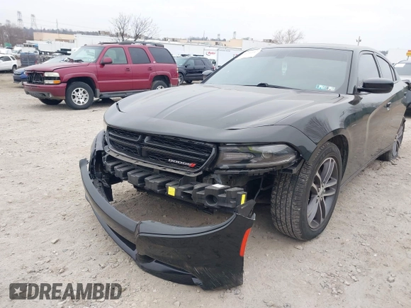 2019 Dodge Charger SXT with VIN 2C3CDXJG7KH757728, listed as a IAAI auction lot 41797017 with 68,063 mi miles and . Bid and sale history available at DreamBid. Image 6.
