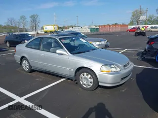 1996 Honda Civic EX with VIN 1HGEJ8249TL090500, listed as a IAAI auction lot 41927643 with 164,067 mi miles. Bid and sale history available at carsss.com. Image 1.