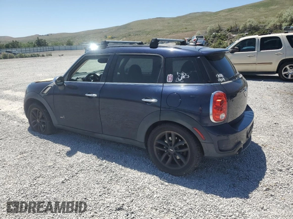 2013 MINI Countryman S ALL4 with VIN WMWZC5C50DWM15256, listed as a Copart auction lot 58080895 with 123,514 mi miles and Salvage title. Bid and sale history available at DreamBid. Image 2.