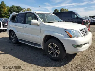 2004 Lexus GX 470 with VIN JTJBT20XX40033938, listed as a Copart auction lot 70871164 with 214,565 mi miles and Salvage Title. Bid and sale history available at carsss.com. Image 4.