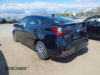 2021 Toyota Prius L Eco with VIN JTDKAMFU6M3135799, listed as a IAAI auction lot 42064241 with 77,120 mi miles and . Bid and sale history available at DreamBid. Image 3.