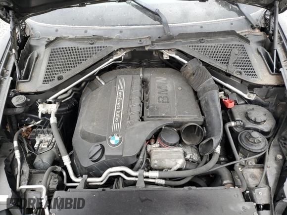 2012 BMW X5 35i with VIN 5UXZV4C59CL763577, listed as a Copart auction lot 62496155 with 148,240 mi miles and Clean title. Bid and sale history available at DreamBid. Image 12.