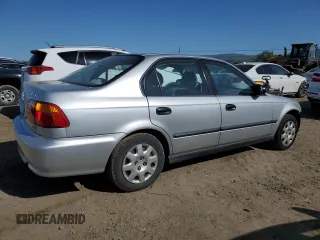 1999 Honda Civic LX with VIN 2HGEJ6677XH506586, listed as a Copart auction lot 48595735 with 86,159 mi miles and Salvage Title. Bid and sale history available at carsss.com. Image 3.