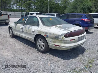 1999 Oldsmobile Aurora z VIN 1G3GR62CXX4100897, wystawiony jako IAAI lot #42277912 z przebiegiem 179 680 mil mil oraz . Historia ofert i sprzedaży dostępna na DreamBid. Obrazek 3.