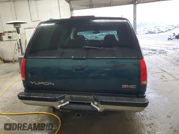 1998 GMC Yukon with VIN 1GKEC13RXWJ731667, listed as a Copart auction lot 78848954 with 202,164 mi miles and Salvage Title. Bid and sale history available at carsss.com. Image 6.