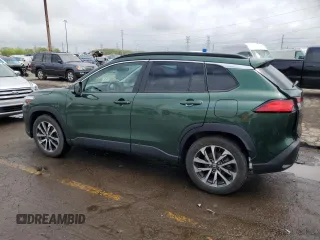 2022 Toyota Corolla Cross XLE with VIN 7MUDAABG6NV006829, listed as a Copart auction lot 55626965 with 23,187 mi miles and Salvage title. Bid and sale history available at DreamBid. Image 2.