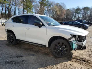 2024 Mazda CX-5 2.5 Carbon Turbo with VIN JM3KFBAY7R0378845, listed as a Copart auction lot 49229395 with 15,031 mi miles and Salvage Title. Bid and sale history available at carsss.com. Image 4.