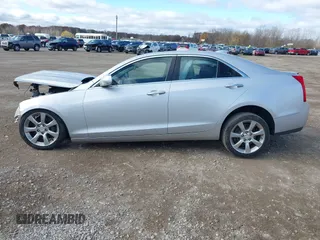 2015 Cadillac ATS Luxury RWD z VIN 1G6AB5RXXF0123831, wystawiony jako IAAI lot #40754245 z przebiegiem Nie podano mil oraz . Historia ofert i sprzedaży dostępna na DreamBid. Obrazek 14.