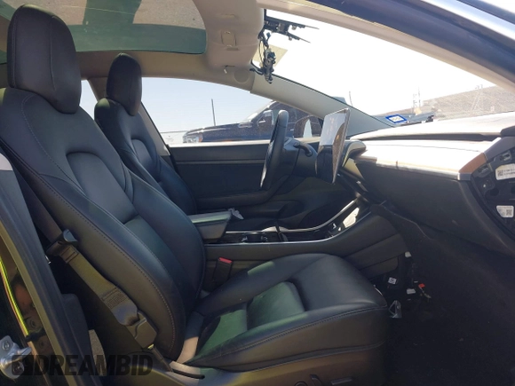 2020 Tesla Model 3 Standard Range Plus with VIN 5YJ3E1EAXLF614002, listed as a IAAI auction lot 41758898 with 42,363 mi miles and . Bid and sale history available at DreamBid. Image 5.