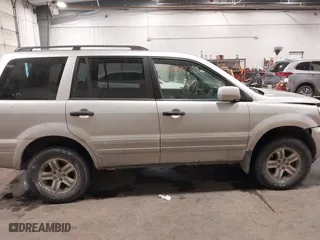 2005 Honda Pilot EX-L with VIN 2HKYF18575H557005, listed as a IAAI auction lot 41647830 with 245,992 mi miles. Bid and sale history available at carsss.com. Image 13.