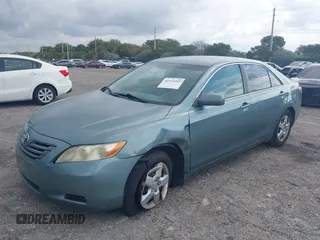 2007 Toyota Camry CE with VIN 4T1BE46K37U569515, listed as a IAAI auction lot 41974482 with 242,042 mi miles. Bid and sale history available at carsss.com. Image 2.