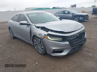 2020 Honda Insight Touring z VIN 19XZE4F90LE004714, wystawiony jako IAAI lot #41923914 z przebiegiem 74 246 mil mil oraz . Historia ofert i sprzedaży dostępna na DreamBid. Obrazek 1.