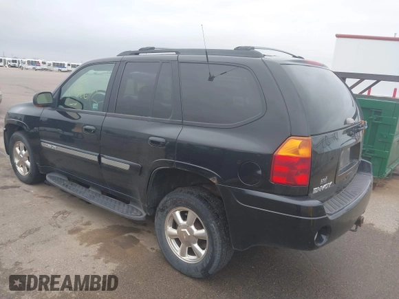 2002 GMC Envoy SLT with VIN 1GKDT13S222143135, listed as a IAAI auction lot 42136672 with 206,064 mi miles. Bid and sale history available at carsss.com. Image 3.