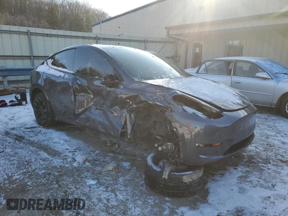 2023 Tesla Model Y Long Range with VIN 7SAYGDEE6PF752570, listed as a Copart auction lot 84927794 with 52,297 mi miles and Salvage Title. Bid and sale history available at DreamBid. Image 4.