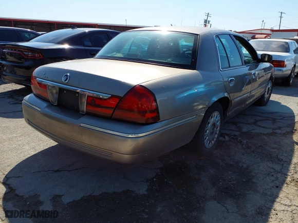 2003 Mercury Grand Marquis GS Convenience with VIN 2MEFM74W43X662724, listed as a IAAI auction lot 42036847 with 234,008 mi miles. Bid and sale history available at carsss.com. Image 4.