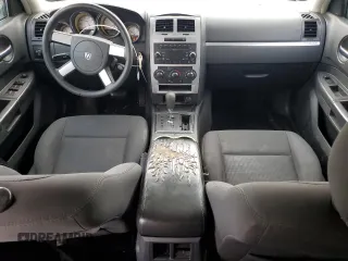 2010 Dodge Charger SXT with VIN 2B3CA3CV7AH166209, listed as a Copart auction lot 48998165 with 172,808 mi miles and Salvage Title. Bid and sale history available at DreamBid. Image 8.