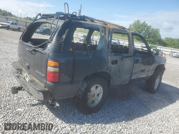 2003 Chevrolet Tahoe LS z VIN 1GNEC13Z03J273863, wystawiony jako Copart lot #56574255 z przebiegiem Nie podano mil oraz Szkoda całkowita • Salvage title. Historia ofert i sprzedaży dostępna na DreamBid. Obrazek 3.