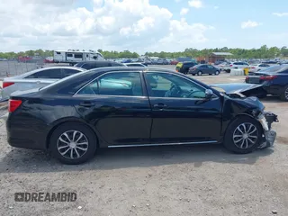 2014 Toyota Camry L with VIN 4T4BF1FKXER402857, listed as a IAAI auction lot 42144757 with 192,081 mi miles and . Bid and sale history available at DreamBid. Image 12.
