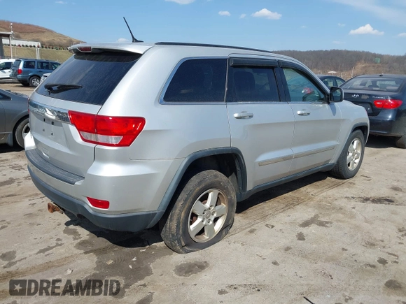 2013 Jeep Grand Cherokee Laredo with VIN 1C4RJFAG5DC634685, listed as a IAAI auction lot 41792147 with 260,594 mi miles. Bid and sale history available at carsss.com. Image 4.
