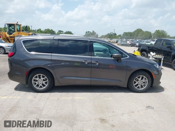 2023 Chrysler Pacifica Touring L with VIN 2C4RC1BG6PR590302, listed as a IAAI auction lot 42451369 with 72,097 mi miles and . Bid and sale history available at DreamBid. Image 13.