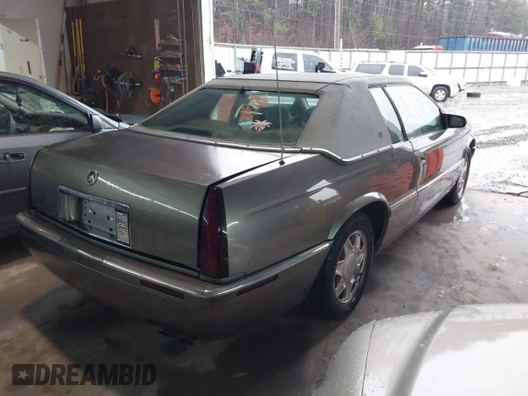 1999 Cadillac Eldorado ESC z VIN 1G6EL12Y8XU612393, wystawiony jako IAAI lot #41761839 z przebiegiem 104 994 mil mil oraz . Historia ofert i sprzedaży dostępna na DreamBid. Obrazek 4.