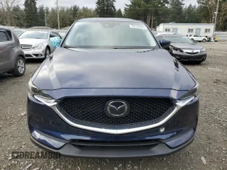 2018 Mazda CX-5 Touring with VIN JM3KFACM8J1349356, listed as a Copart auction lot 89154055 with 82,719 mi miles and Salvage Title. Bid and sale history available at carsss.com. Image 5.