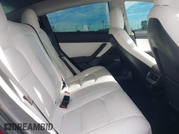 2020 Tesla Model 3 Standard Range Plus with VIN 5YJ3E1EA9LF718027, listed as a IAAI auction lot 41679320 with 68,987 mi miles. Bid and sale history available at carsss.com. Image 8.