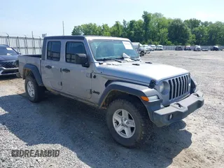 2020 Jeep Gladiator Sport S z VIN 1C6HJTAG7LL128940, wystawiony jako IAAI lot #42108154 z przebiegiem 90 596 mil mil oraz . Historia ofert i sprzedaży dostępna na DreamBid. Obrazek 1.