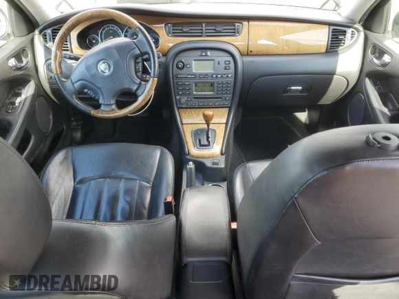 2004 Jaguar X-Type with VIN SAJEA51C74WD56736, listed as a Copart auction lot 48038295 with 115,817 mi miles and Salvage Title. Bid and sale history available at DreamBid. Image 8.