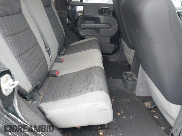 2007 Jeep Wrangler Unlimited X with VIN 1J4GA39177L153387, listed as a IAAI auction lot 42021211 with 207,965 mi miles and . Bid and sale history available at DreamBid. Image 8.