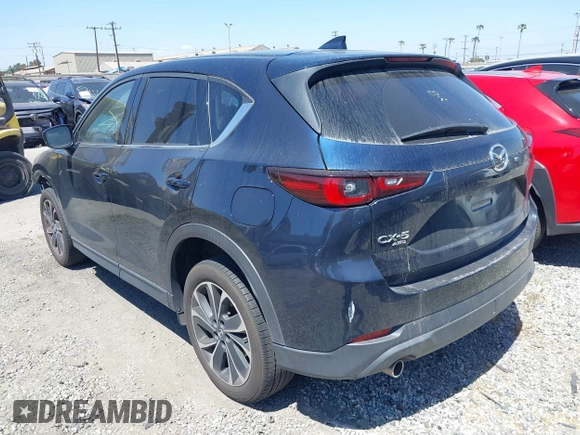 2023 Mazda CX-5 S Premium with VIN JM3KFBDM4P0185865, listed as a IAAI auction lot 42040234 with 32,761 mi miles and . Bid and sale history available at DreamBid. Image 3.