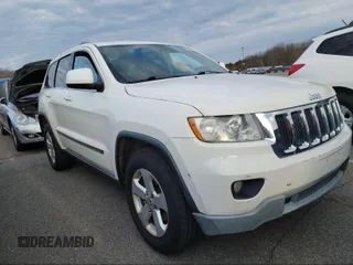 2011 Jeep Grand Cherokee Laredo with VIN 1J4RR4GG1BC669834, listed as a IAAI auction lot 42019804 with 173,943 mi miles. Bid and sale history available at carsss.com. Image 1.