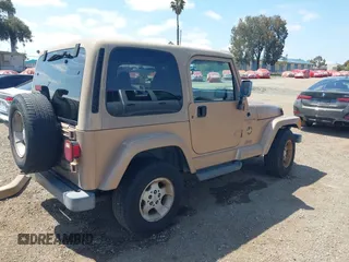 1999 Jeep Wrangler Sahara with VIN 1J4FY49S8XP462512, listed as a IAAI auction lot 42165052 with 146,135 mi miles and . Bid and sale history available at DreamBid. Image 4.